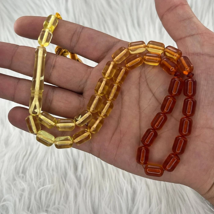 تسبیح پودر کهربا 33 دانه تراش کپسولی دو رنگ کدTA7 2 تسبیح پودر کهربا 33 دانه تراش کپسولی دو رنگ زرد و قهوه ای